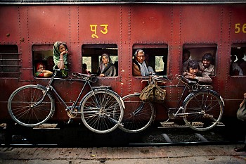 Steve McCurry - Steve McCurry Bicycles on Side of Train